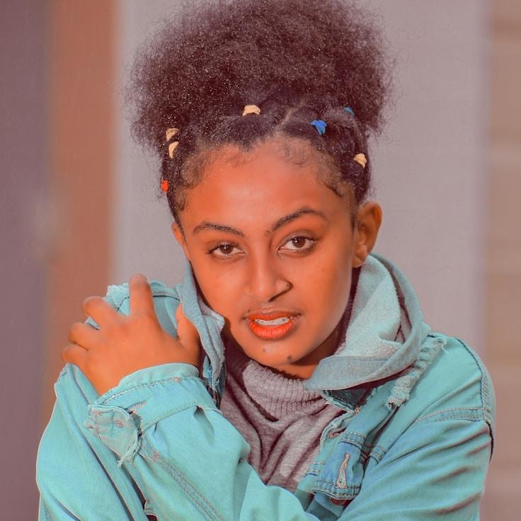 Avery Chen, Lead Design Curator at Bright Valley Station, reviewing corporate floral arrangements